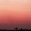 Surf lifestyle photography capturing surfers catching up at Boa Reef in Rote, Indonesia at sunset
