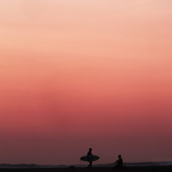Surf lifestyle photography capturing surfers catching up at Boa Reef in Rote, Indonesia at sunset